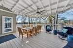 Screened in porch with seating for 8 plus lounge furniture
